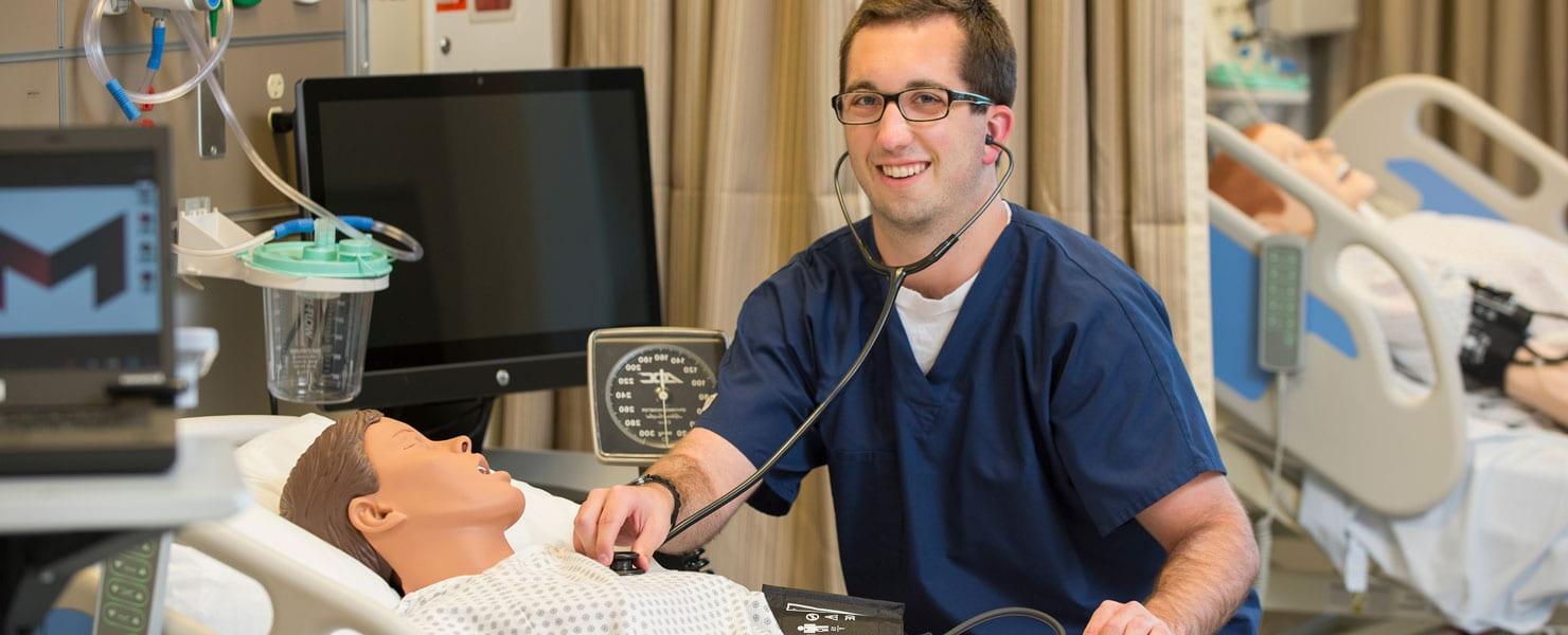 nursing student learning in nursing simulation lab